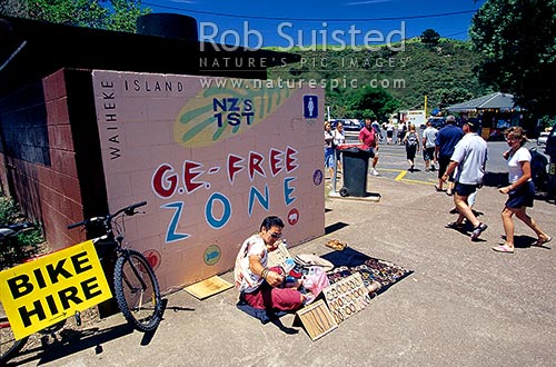 Waiheke Island welcome and street seller at Matiatia Ferry terminal -GE Free zone sign, Waiheke Island, Auckland City District, Auckland Region, New Zealand (NZ)