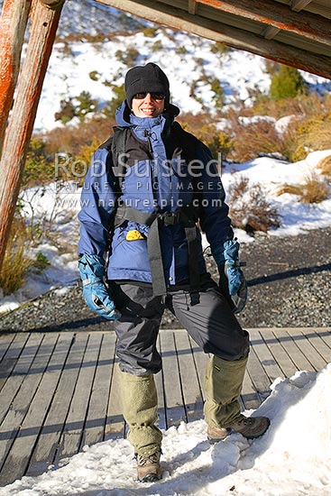 Winter tramper / hiker demonstrating well prepared clothing for cold snow conditions, Tongariro National Park, Ruapehu District, Manawatu-Wanganui Region, New Zealand (NZ)