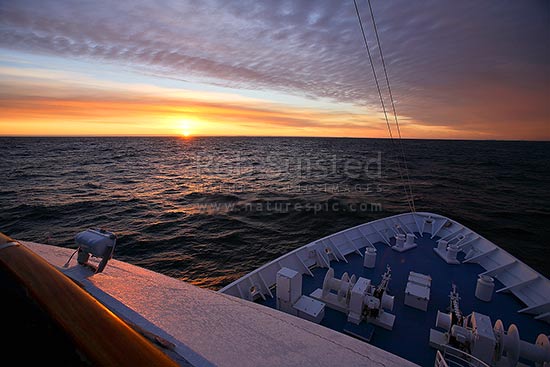 Antarctic sunset over the Antarctic continent, from ship, Antarctica