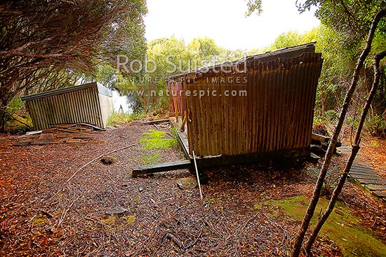 Historic Erebus Cove Boatshed (left), built for shipwrecked survivors and castaways in 1891, and depot built later (right), Auckland Islands, NZ Sub Antarctic District, NZ Sub Antarctic Region, New Zealand (NZ)