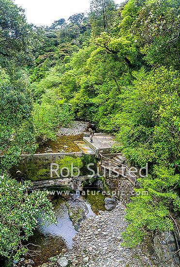 Wellington Water water collection weir at Big Huia Creek, Orongorongo River valley. Low river level with dry weir. Aerial view, Remutaka Range, Wainuiomata, Hutt City District, Wellington Region, New Zealand (NZ)