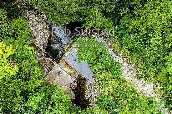 Wellington Water water collection weir at Big Huia Creek, Orongorongo River valley. Low river level with dry weir. Aerial view from above, Remutaka Range, Wainuiomata, Hutt City District, Wellington Region, New Zealand (NZ)