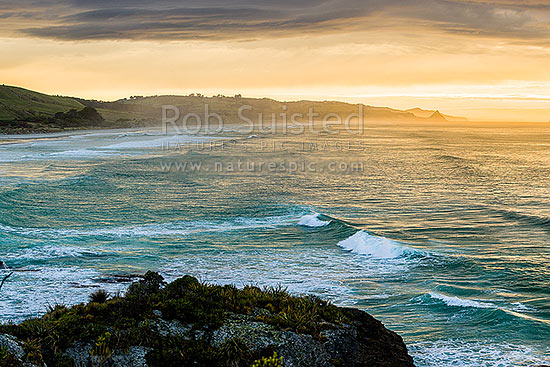 Brighton Beach, Waldron foreshore and Kaikorai Stream mouth on a moody sunrise. Blackhead point and Otago Peninsula beyond, Brighton, Dunedin City District, Otago Region, New Zealand (NZ)