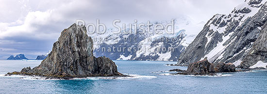 Point Wild on Elephant Island, where Shackleton's men stayed for 128 days (right). Ice-covered mountainous island in outer reaches of South Shetland Islands. Panorama, Elephant Island, Antarctica Region, Antarctica