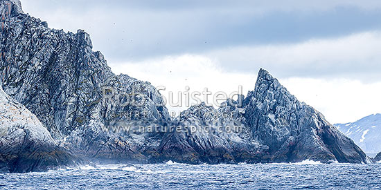 Rugged rocky shore of Cornwallis Island in the South Shetland Islands. Panorama. Granodiorite rock, Elephant Island, Antarctica Region, Antarctica