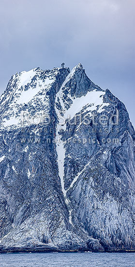 Cornwallis Island, a barren rugged island in the Antarctic South Shetland Islands group. Distinctive rock tor on summit, Elephant Island, Antarctica Region, Antarctica