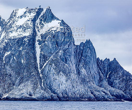 Cornwallis Island, a barren rugged island in the Antarctic South Shetland Islands group. Distinctive rock tor on summit, Elephant Island, Antarctica Region, Antarctica