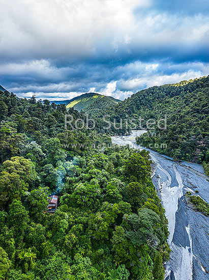 Orongorongo River Valley, looking downsteam towards Big Bend. Showing private hut amongst forest. Aerial view, Remutaka Forest Park, Hutt City District, Wellington Region, New Zealand (NZ)