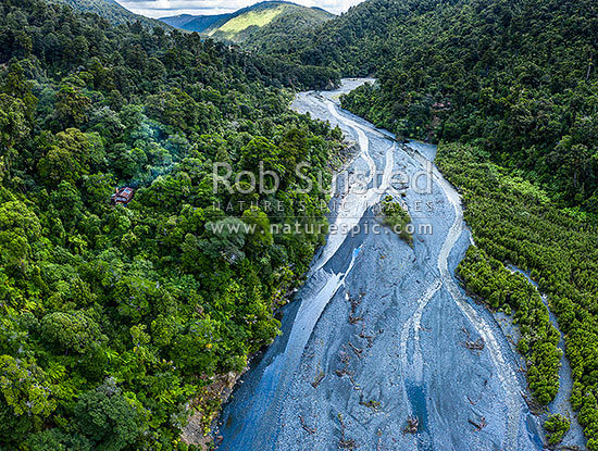 Orongorongo River Valley, looking downsteam towards Big Bend. Showing private hut amongst forest. Aerial view, Remutaka Forest Park, Hutt City District, Wellington Region, New Zealand (NZ)