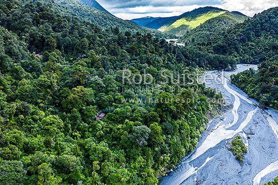 Orongorongo River Valley, looking downsteam towards Big Bend. Showing private hut amongst forest. Aerial view, Remutaka Forest Park, Hutt City District, Wellington Region, New Zealand (NZ)