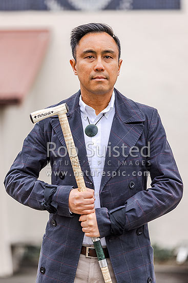 Chris Tse, holding NZ Poet Laureate Award 2022 to 2025. Portrait in Haining Street Wellington, Wellington, Wellington City District, Wellington Region, New Zealand (NZ)