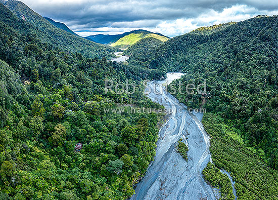 Orongorongo River Valley, looking downsteam towards Big Bend. Showing private hut amongst forest. Aerial view, Remutaka Forest Park, Hutt City District, Wellington Region, New Zealand (NZ)