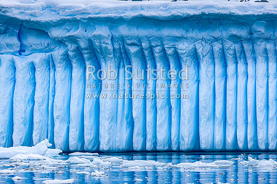 Iceberg in Antarctica showing vertical striations pattern caused by melt air bubble fluting, Antarctic Peninsula, Antarctica Region, New Zealand (NZ)