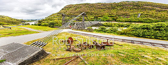 Brunner Suspension Bridge over the Grey River at the historic Brunner Mine Site, one of NZ's earliest industrial sites from 1860's onwards. Stillwater. Panorama, Taylorville, Grey District, West Coast Region, New Zealand (NZ)