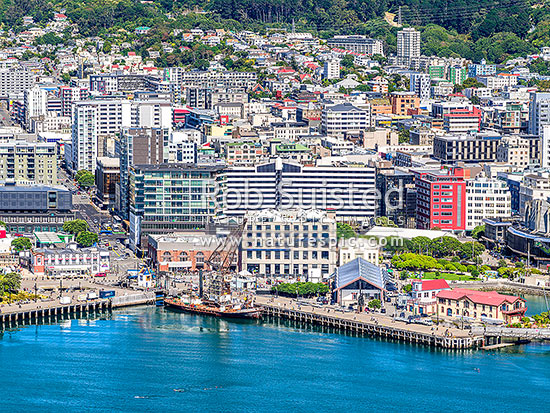 Wellington City and Harbour waterfront at Taranaki Street wharf, with SS Hikitia crane, Wharewaka and Star Boating Club in foreground. Aerial view, Wellington, Wellington City District, Wellington Region, New Zealand (NZ)