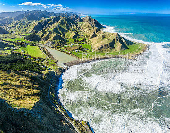 Te Awaiti and Greentops Stations at the Oterei River mouth at Tora. Aerial view looking north along the Wairarapa coast and farmland, Tora, South Wairarapa District, Wellington Region, New Zealand (NZ)