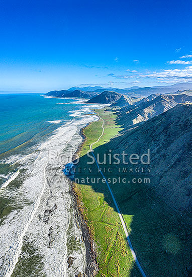 Tora Coastline and Te Awaiti Road running south towards Manurewa Point (centre) and Tora Farm Settlement beyond. Aerial view, Tora, South Wairarapa District, Wellington Region, New Zealand (NZ)