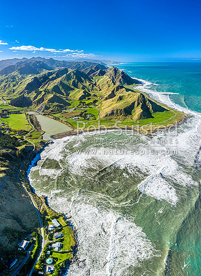 Te Awaiti Station at the Oterei River mouth at Tora. Aerial view looking north along the Wairarapa coast and farmland, Tora, South Wairarapa District, Wellington Region, New Zealand (NZ)