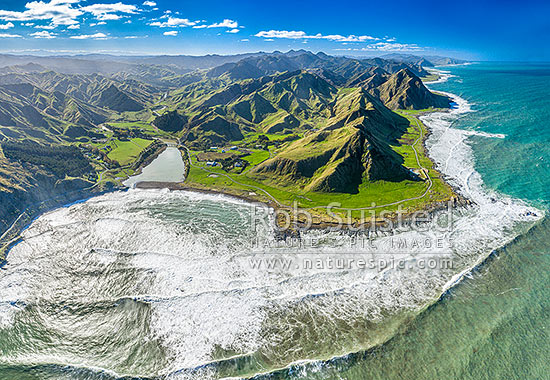 Te Awaiti and Greentops Stations at the Oterei River mouth at Tora. Aerial view looking north along the Wairarapa coast and farmland, Tora, South Wairarapa District, Wellington Region, New Zealand (NZ)