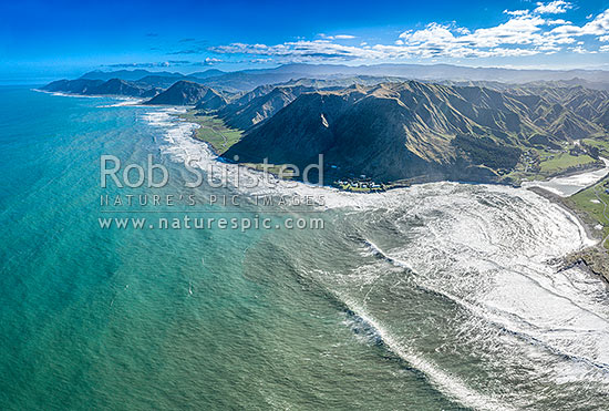 Tora Coastline and Te Awaiti Road running south towards Manurewa Point and Tora Farm Settlement beyond. Oterei River far right. Aerial view, Tora, South Wairarapa District, Wellington Region, New Zealand (NZ)