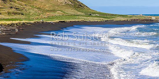 Te Awaiti surf and waves rolling into the Oterei River Mouth at Tora beach. Te Awaiti Station beyond, Tora, South Wairarapa District, Wellington Region, New Zealand (NZ)