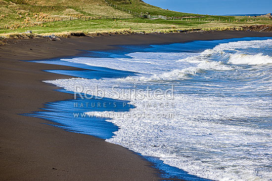 Te Awaiti surf and waves rolling into the Oterei River Mouth at Tora beach. Te Awaiti Station beyond, Tora, South Wairarapa District, Wellington Region, New Zealand (NZ)