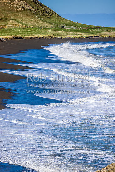 Te Awaiti surf and waves rolling into the Oterei River Mouth at Tora beach. Te Awaiti Station beyond, Tora, South Wairarapa District, Wellington Region, New Zealand (NZ)