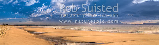 Ruakaka Beach panorama, with people walking in evening light. Mt Manaia (right, 420m) behind right, at the Whangarei Harbour Heads. Wide aspect of 65434, Ruakaka, Whangarei District, Northland Region, New Zealand (NZ)