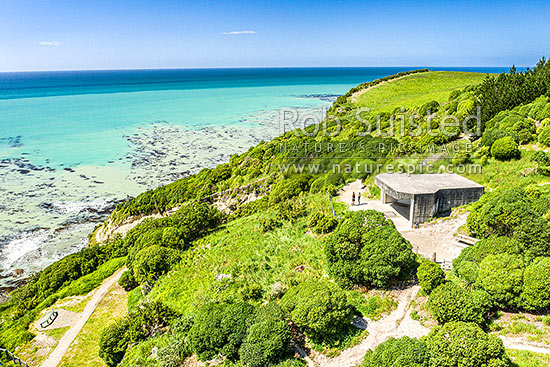 Oamaru coast and Cape Wanbrow with concrete WWII coastal defence battery on walking track above Cape Wanbrow. Aerial view, Oamaru, Waitaki District, Canterbury Region, New Zealand (NZ)