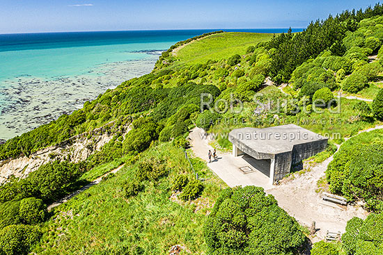 Oamaru coast and Cape Wanbrow with concrete WWII coastal defence battery on walking track above Cape Wanbrow. Aerial view, Oamaru, Waitaki District, Canterbury Region, New Zealand (NZ)