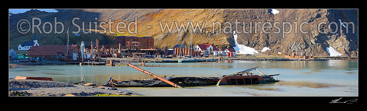 Image of Grytviken whaling station remains in King Edward Cove. Wreck of Louise in foreground, Whaler's Church left, Museum right. Panorama, Grytviken, King Edward Cove, South Georgia stock photo image