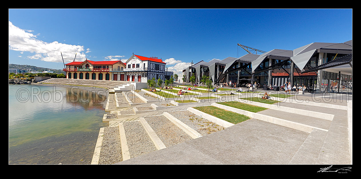 Image of Wellington waterfront lagoon, historic boatsheds (Star Boating Club 1885 and Wellington Rowing Club 1894) and Wharewaka o Poneke building on a summers day. Panorama, Wellington, Wellington City District, Wellington Region, New Zealand (NZ) stock photo image