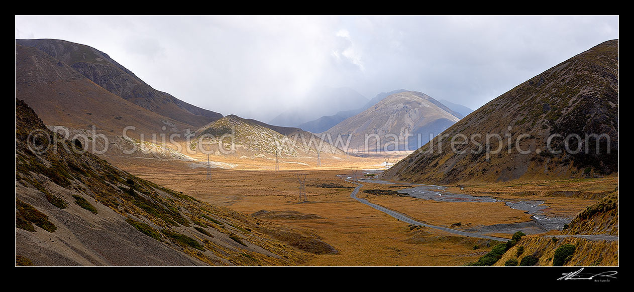 Image of Island Saddle with Wairau - Hanmer Springs Hydro Road descending towards Lake Tennyson. Paget Ridge left, St James Range centre, Mt Southey right. Panorama, Molesworth Station, Marlborough District, Marlborough Region, New Zealand (NZ) stock photo image