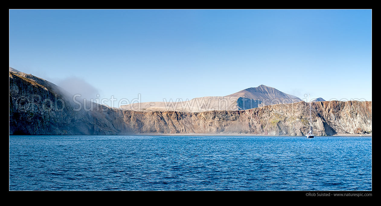 Image of Sailboat anchored in Sr-hamna harbour at Bear Island (Bjrnya). Mount Urd (535m) behind. Panorama, Bear Island (Bjrnya), Svalbard stock photo image