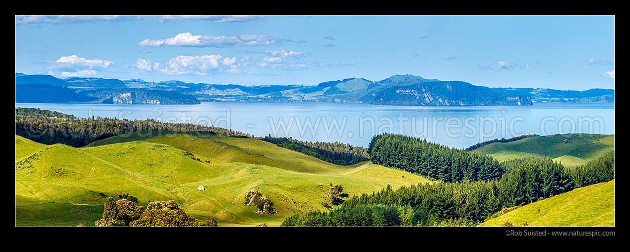 Image of Lake Taupo panorama seen from Western Lakes Road farmland near Whanganui Bay. Whangamata Bluffs and Whakaroa Point right. Kinloch centre, Western Lake Taupo, Taupo District, Waikato Region, New Zealand (NZ) stock photo image