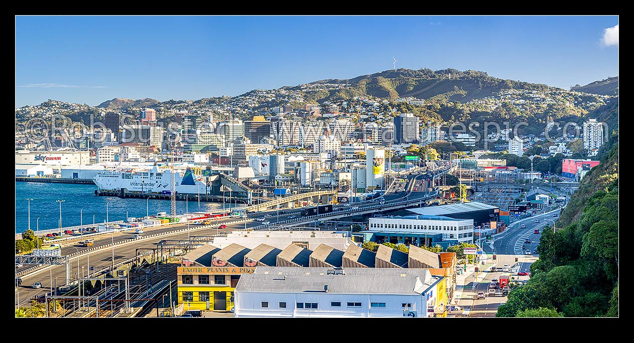 Image of Wellington from Kaiwharawhara and Thorndon. Wellington Motorway and rail corridor entering Wellington City from the north, ferry terminal at left. Panorama, Kaiwharawhara, Wellington City District, Wellington Region, New Zealand (NZ) stock photo image