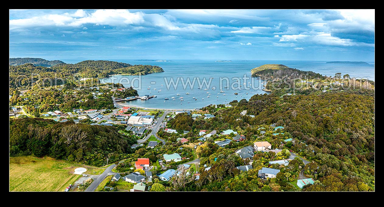 Image of Halfmoon Bay (Oban) the main centre on Rakiura Stewart Island. Aerial panorama view, Halfmoon Bay, Stewart Island District, Southland Region, New Zealand (NZ) stock photo image